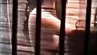 A guy gently licks the hairy lips of a girl’s pussy