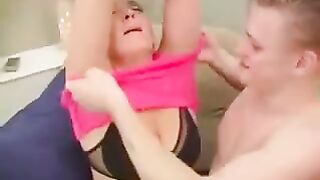 A hot woman is fucking with her grandson in the chair