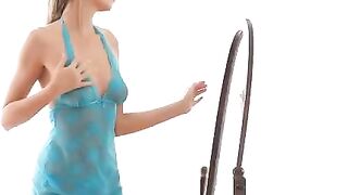A hot chick is making erotic moves in front of the mirror