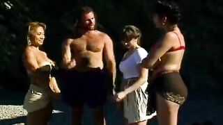 An Asian girl is having fun with a guy on the tennis court