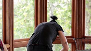 Vietnamese girl fucked with a strapon in the kitchen