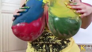 The artist creates a picture while masturbating her pussy with a toy