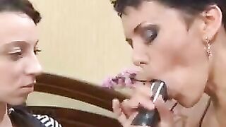 A mother teaches her daughter to make a blowjob in this steamy scene