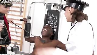 A negro guy is having sex with two girls wearing latex suits