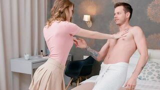 Naked lovers have a conversation on the bed
