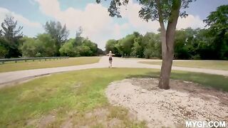 A couple enjoys fun time in the park outdoors, showcasing small tits