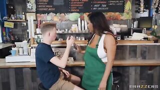 She has big boobs and works as a barista in a coffee shop