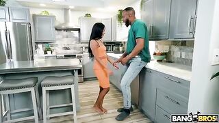 A woman with a small pussy is having sex with a guy with a big dick in the kitchen
