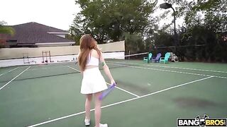The girl is having fun with the coach after tennis training