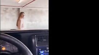 Redhead babe flashes and gets fucked in the public garage, right in the middle of the street