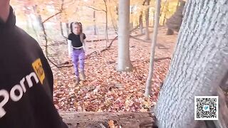 A girl is having fun with someone in the park, getting intimate