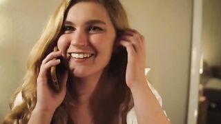A hot blonde has a phone sex with her boyfriend and masturbates for him