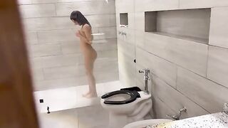 A beautiful Venezuelan naked in the shower, caressed by her lover’s hand