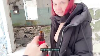 A cute girl stuck a bottle in her pussy outdoors