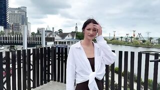 A signal of distress from a beautiful young woman in a bikini